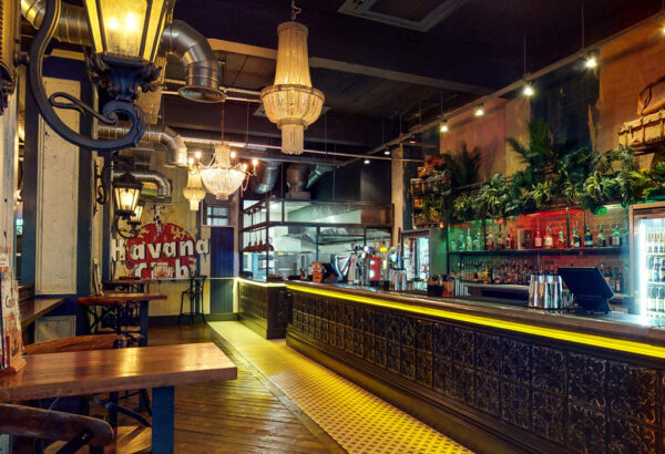 The vibrant bar counter in Castro's Newcastle, in the background a havana club sign,